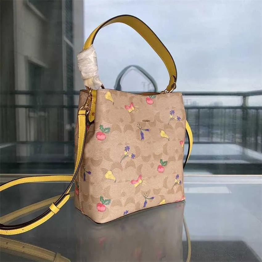 COACH Radiant Petal Floral Print Bucket Bag with Citrus Burst Accents