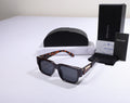 PRADA Tortoiseshell Frame Sunglasses with Black Lenses
