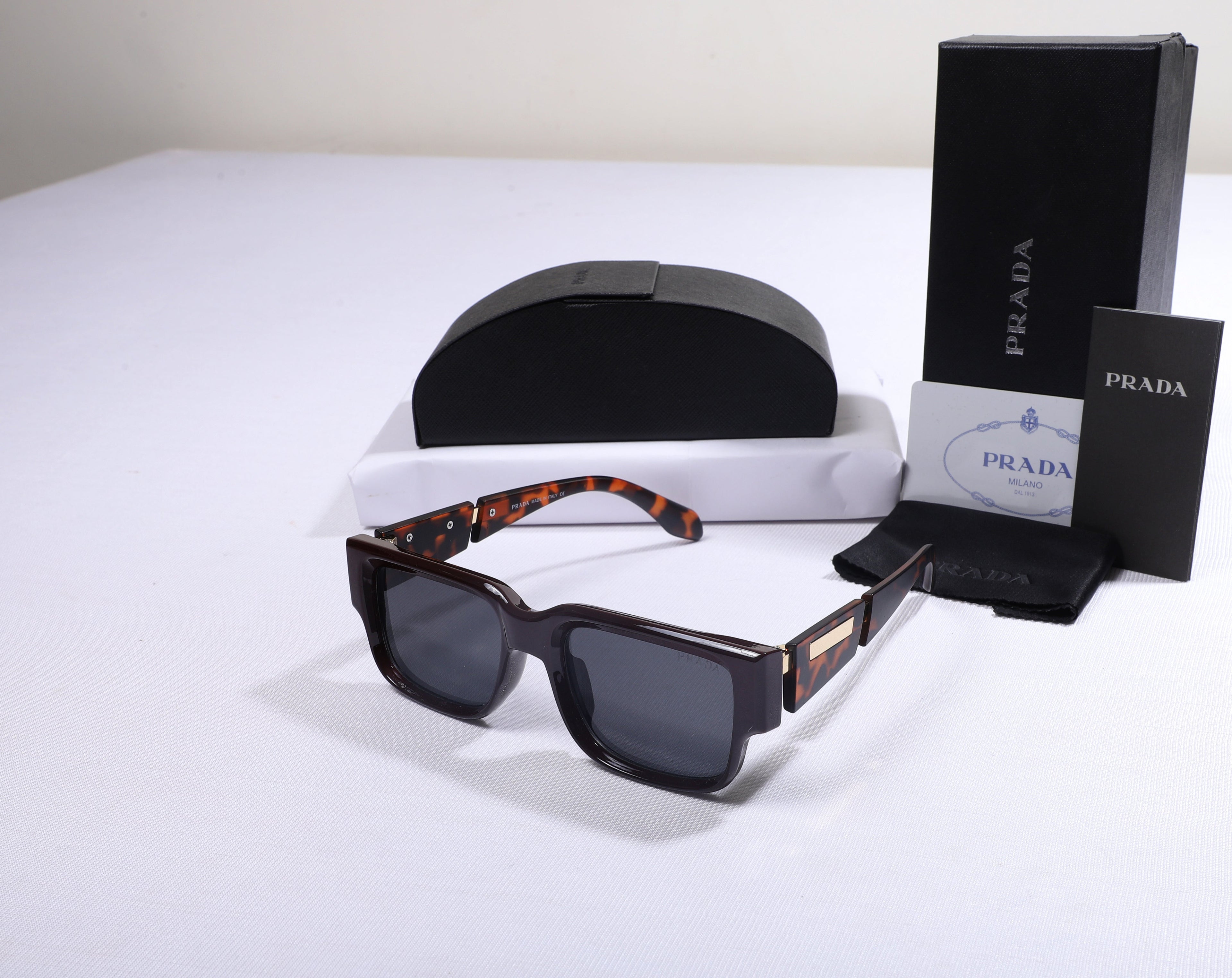 PRADA Tortoiseshell Frame Sunglasses with Black Lenses