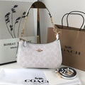 COACH Serene Blush Elegant Hobo Bag with Opulent Chain Detail
